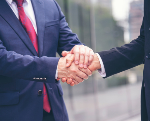 Two men shaking hands on an agreement/promise