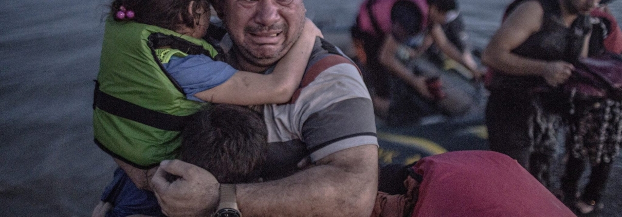 Laith Majid cries tears of joy and relief that he and his children have made it to Europe. Photograph: Daniet Etter/New York Times/Redux /eyevine