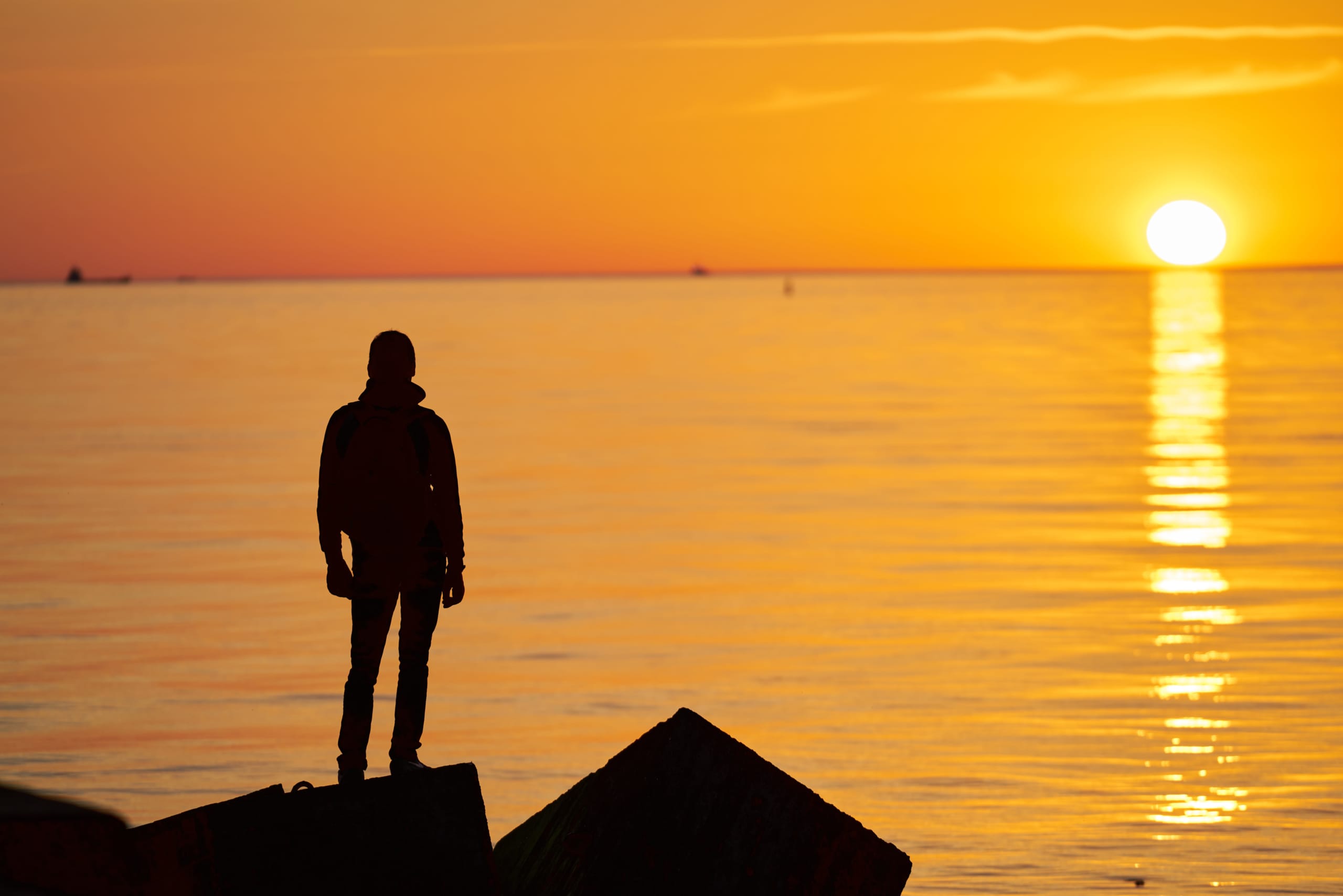 Woman,Or,Man,Standing,On,Rock,Looking,Straight.,Nature,And